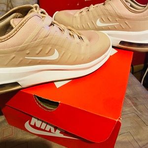 Woman’s tan Nike air max